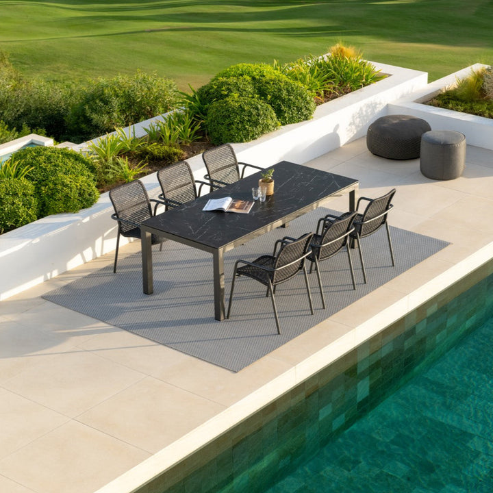 Table de jardin Danli 220x100 avec plateau en céramique pleine et chaise empilable Durham